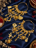 Pair of gold-tone Mini Gajraj bangles with dangling charms on dark blue fabric